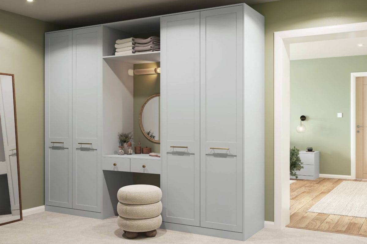 Grey fitted wardrobes with central dressing table, open shelves and upholstered stool
