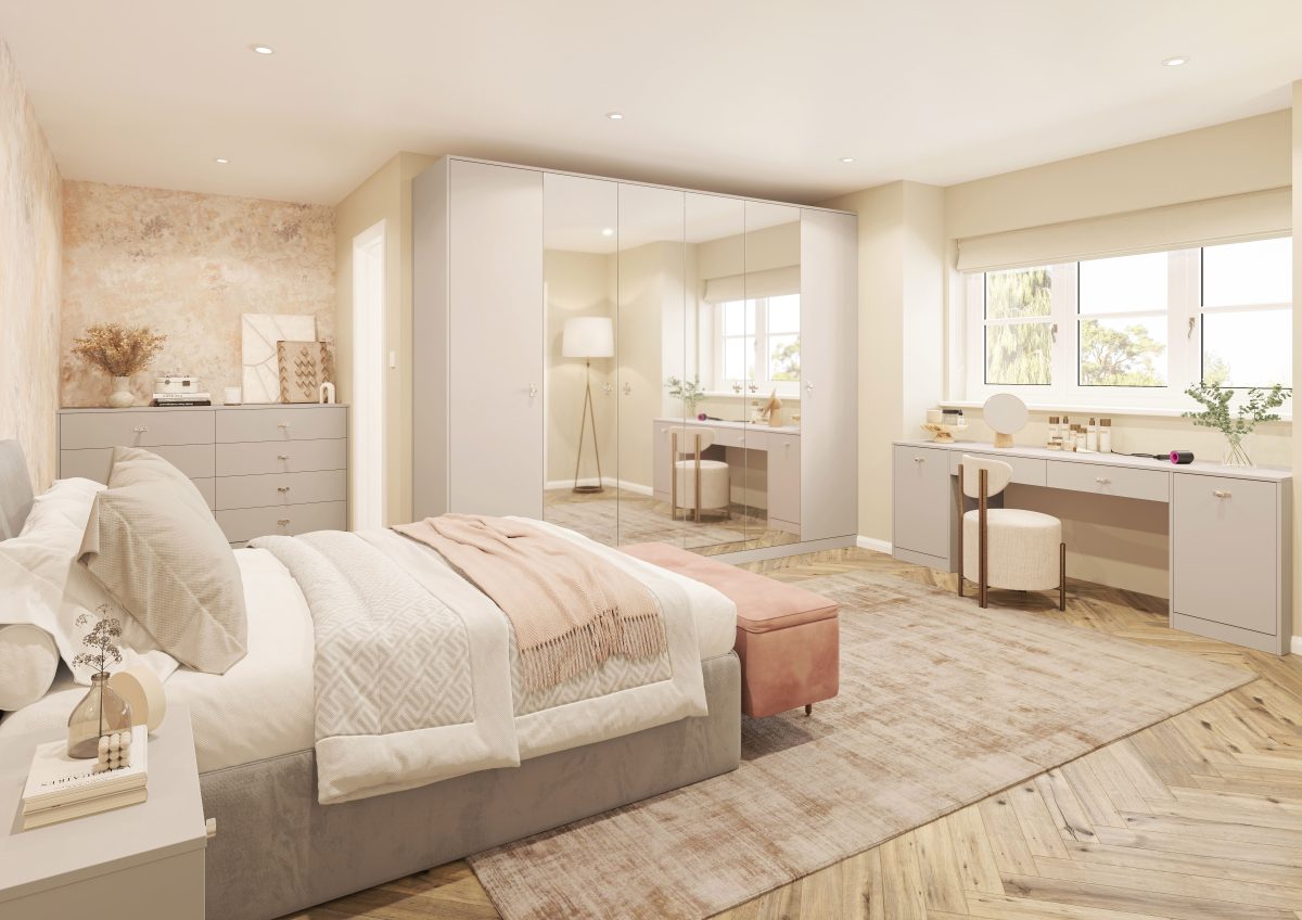 Bespoke fitted bedroom with mirrored wardrobes, dressing table and soft neutral finishes by PB Kitchens & Bathrooms